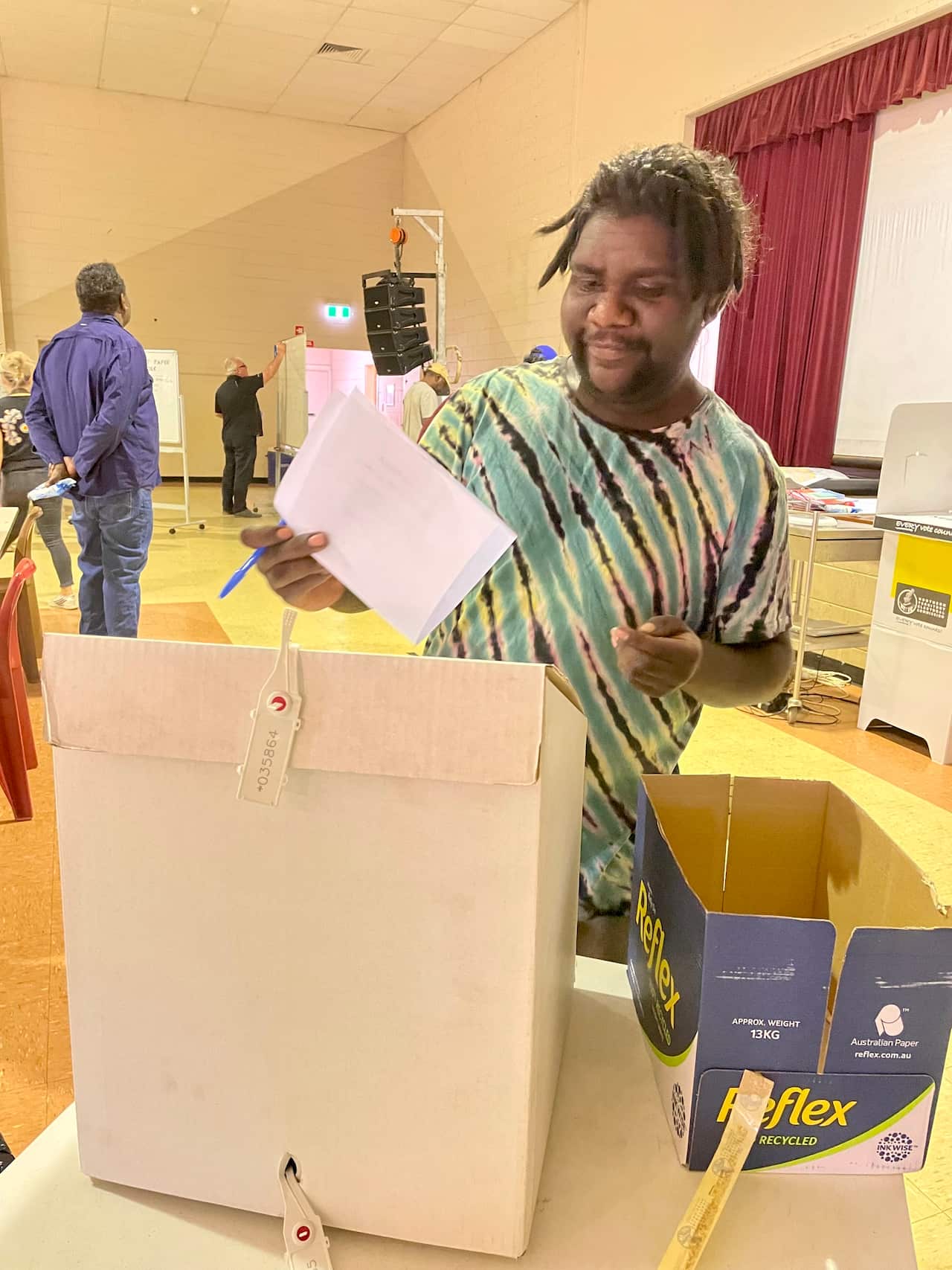 Ricardo Gallagher, the youngest delegate, casting his vote.