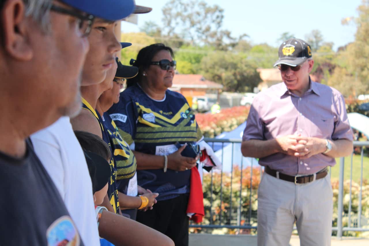 Brewarrina Junior Rugby Club are presented with jerseys at the 2015 Koori Knockout.