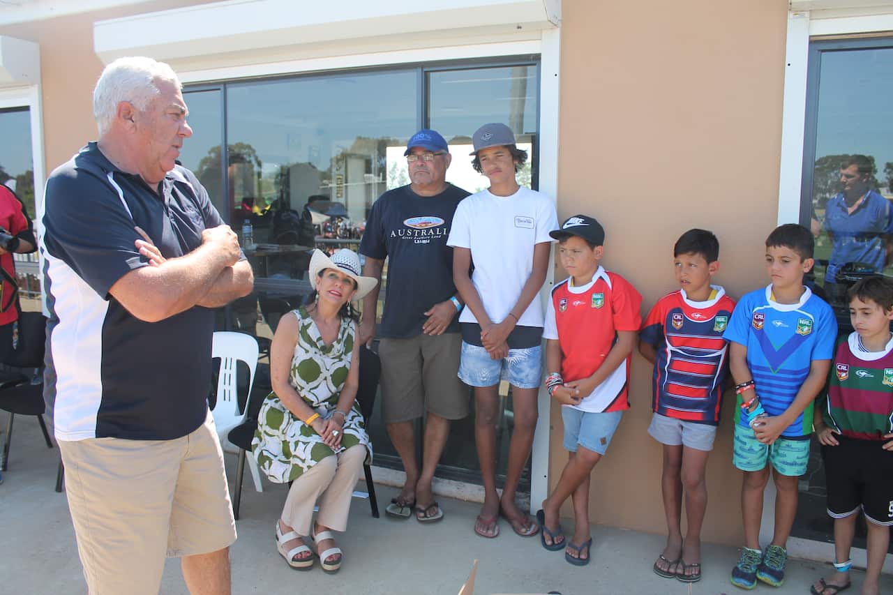 Brewarrina Junior Rugby Club are presented with jerseys at the 2015 Koori Knockout.