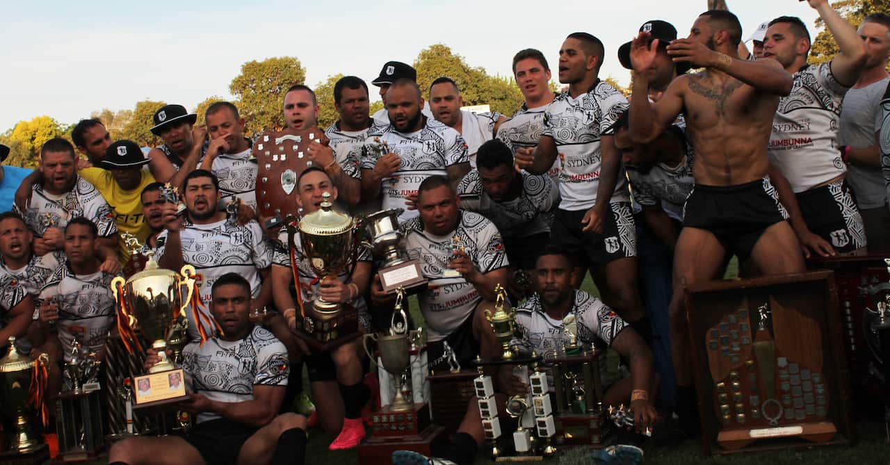 Redfern All Blacks celebrated winning the Men's tournament at the 2015 Koori Knockout.