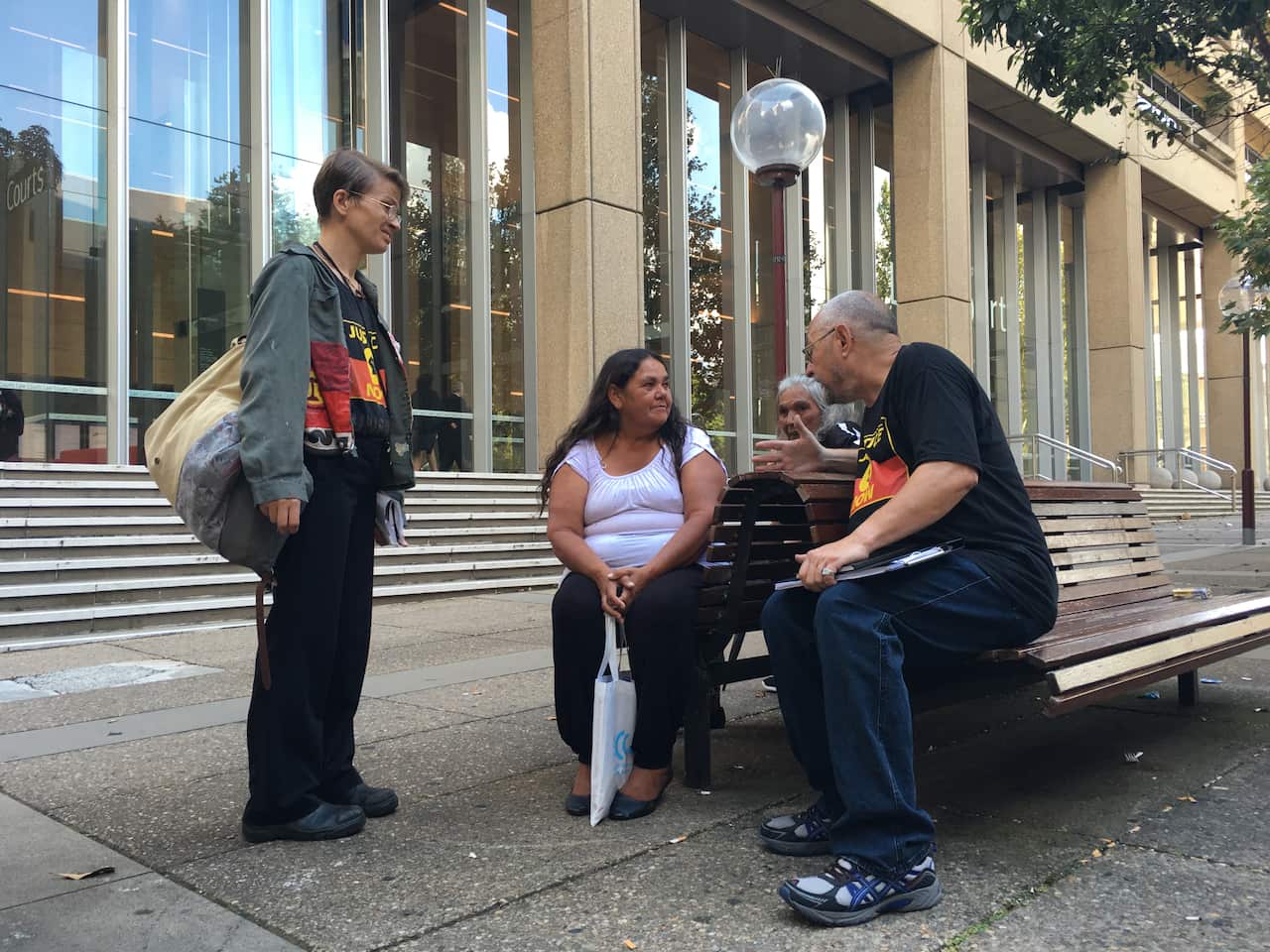 Gail Hickey (centre) with protestors outside the NSW Supreme Court on Friday.