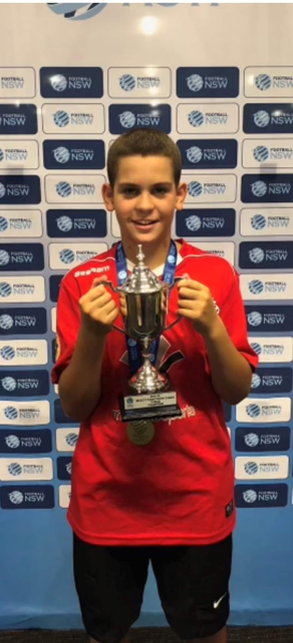 Jai Wright holding a trophy