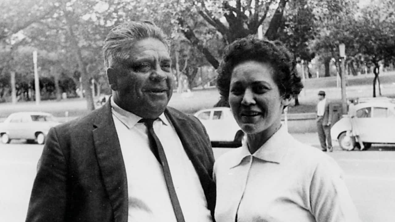 A black and white photo of Joe McGinness and Dulcie Flower.