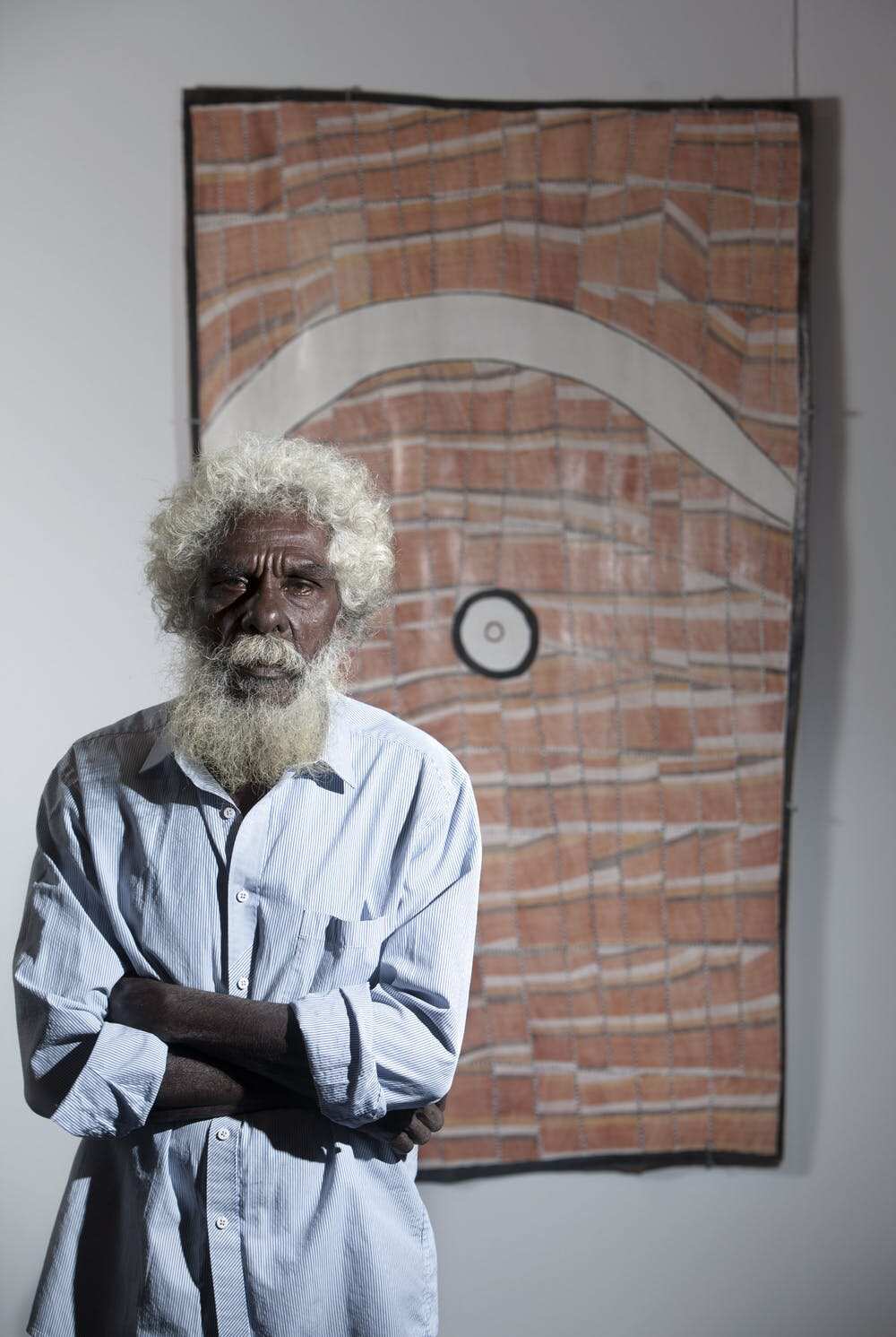 John Mawurndjul with his artwork Dilebang, winner of the 2016 Bark Painting Award at the National Aboriginal and Torres Strait Islander Art Awards. Fiona Morrison/AAP