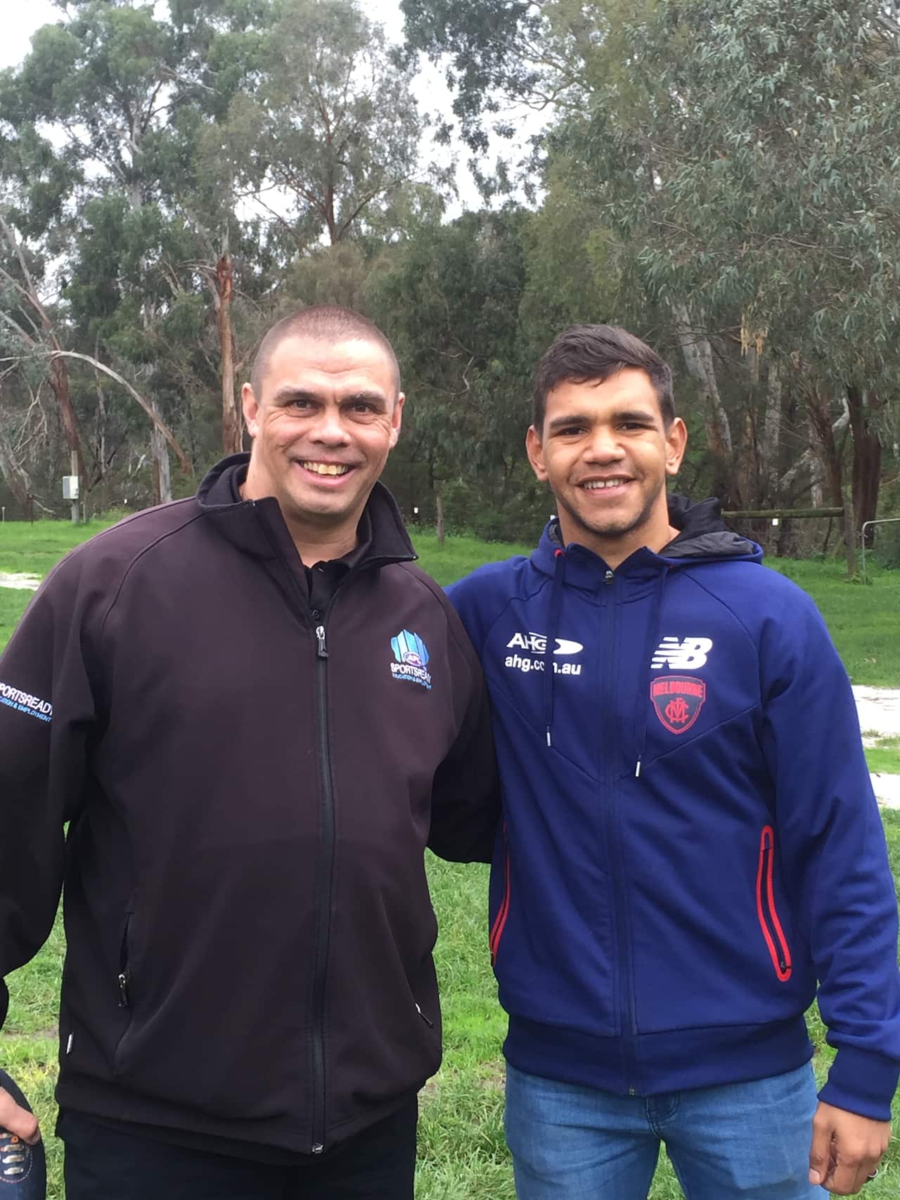 Former Olympic hurdler Kyle Vander-Kuyp with Demons star Neville Jetta at NAIDOC Week in Melbourne.
