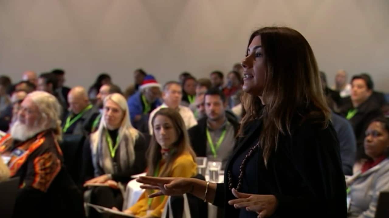 Gunnai-Gunditjmara woman Lidia Thorpe asks Minister Jennings a question during his speech. 