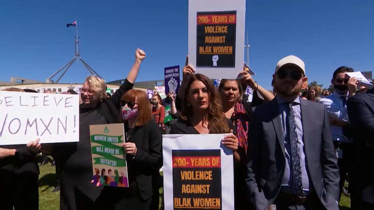 lidia_with_family_violence_protest_sign.jpg