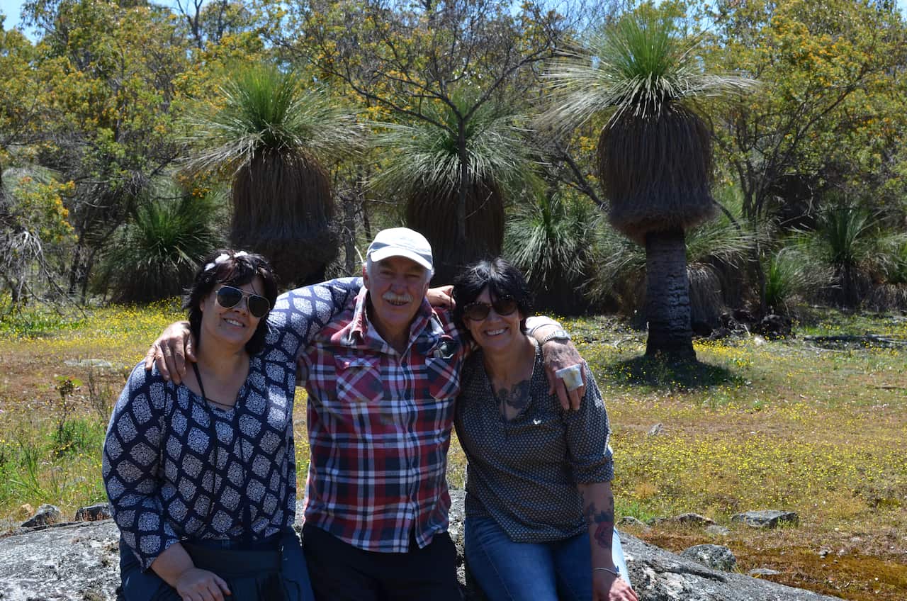 Lisa Smart (right) with her father and sister at “Sorry Place” which she says connects them to the land and their culture.