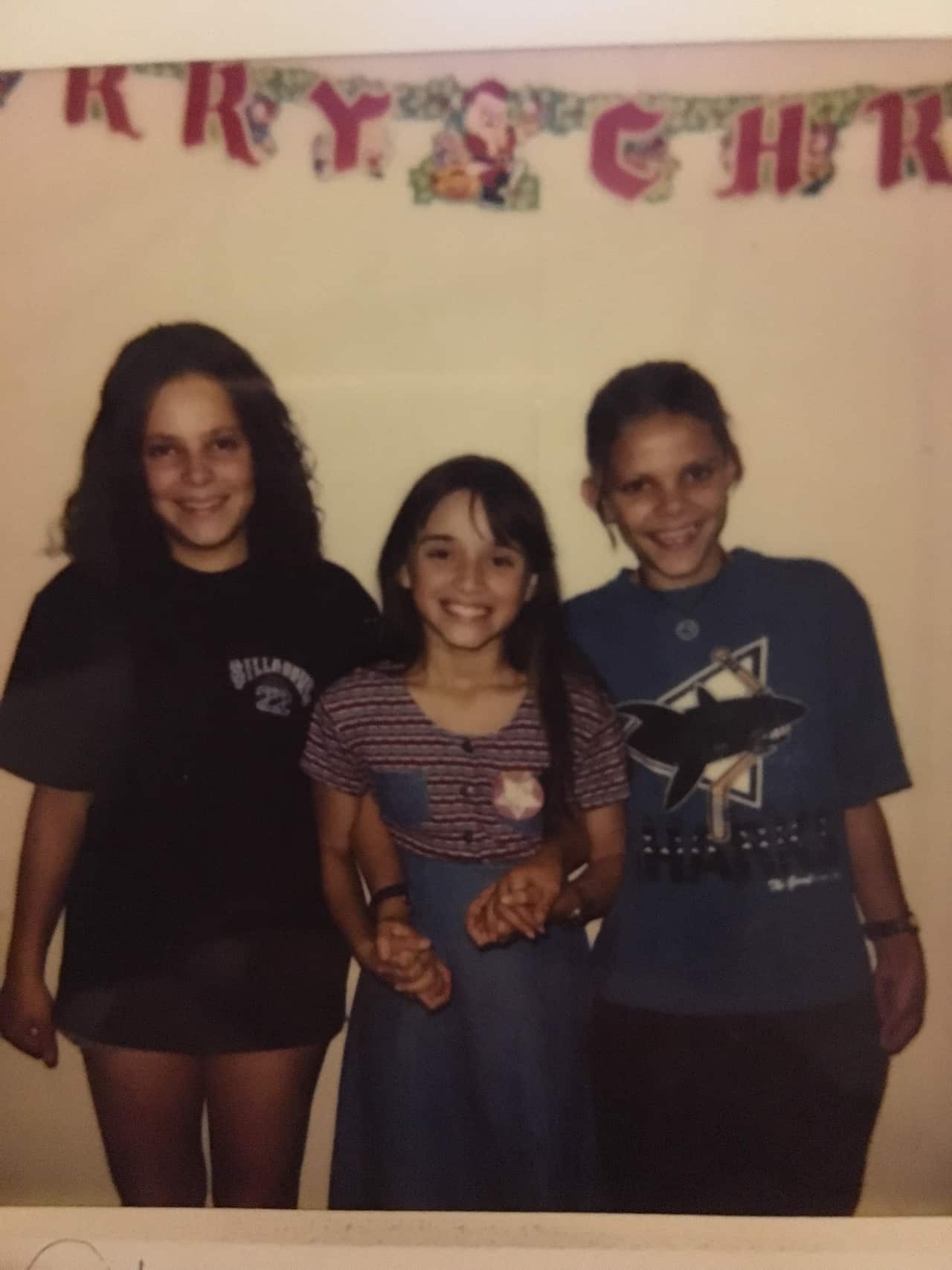A young Lowanna with her cousins at a family Christmas