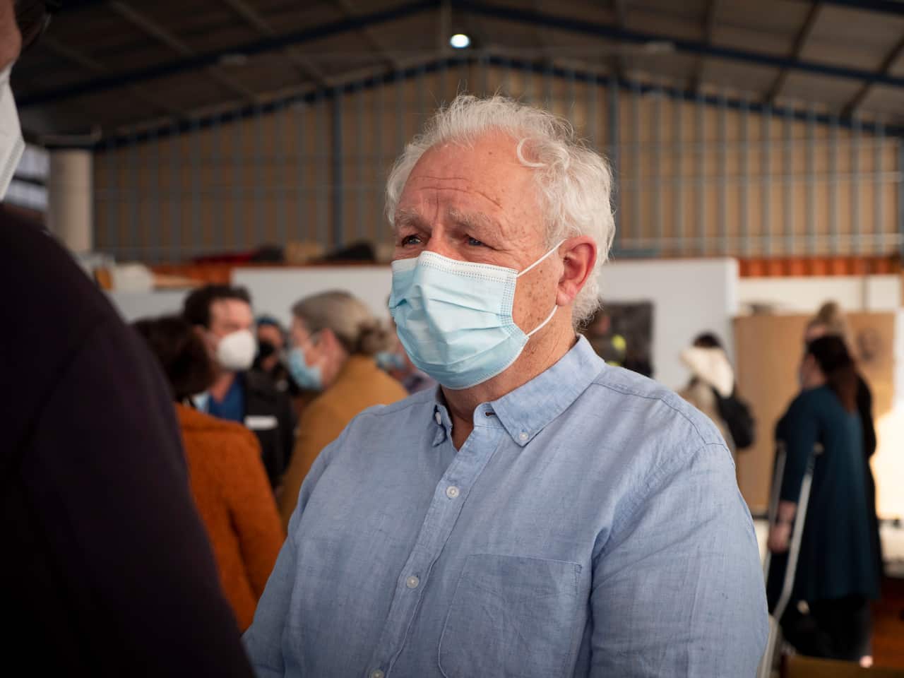 michael mansell wearing a face mask