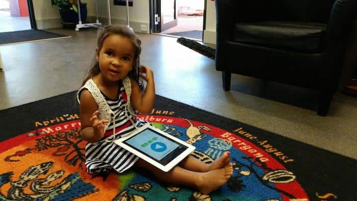 A girl plays with the Yawaru Ngan-ga app (Supplied)