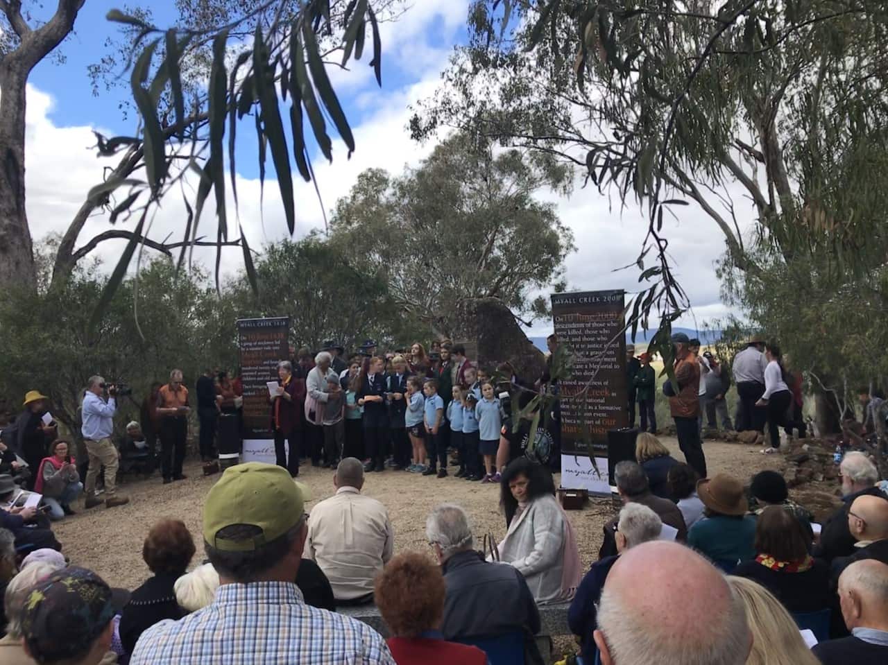 Memorial gathering at the top of a hill