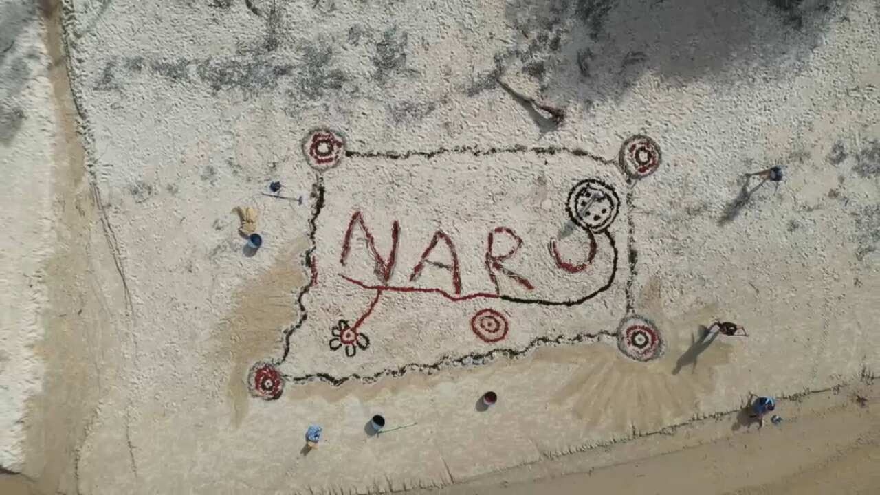 Naru written in the sand