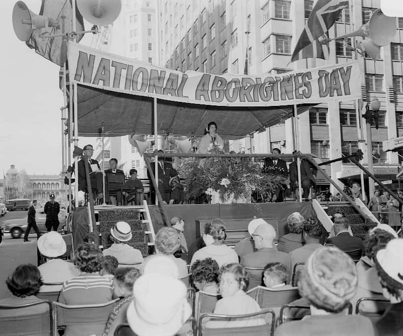 National Aborigines Day is celebrated with speeches in Martin Place on 12 July 1963 as a policeman watches proceedings.