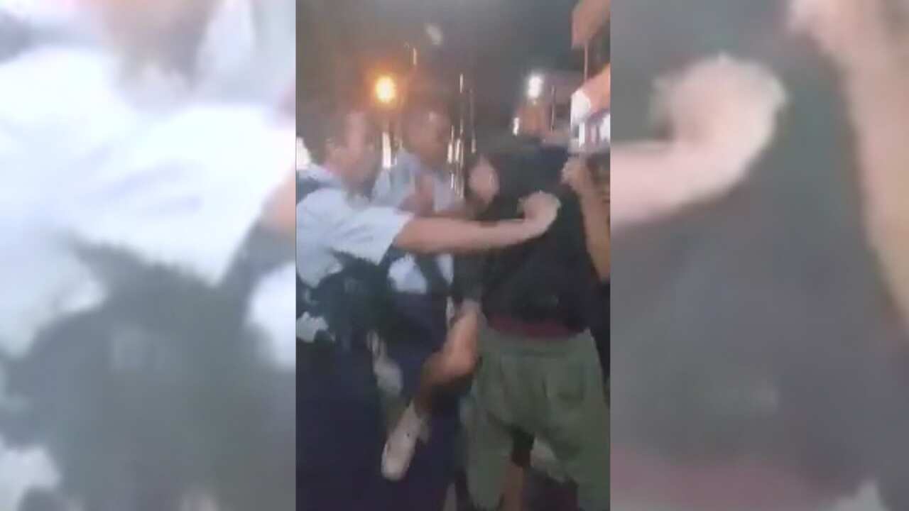 Footage from the video showing police and a group of teenagers at Mount Druitt.