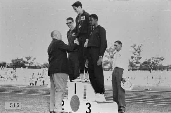 Percy Hobson receiving gold after winning the high jump at the Commonwealth games 1962.