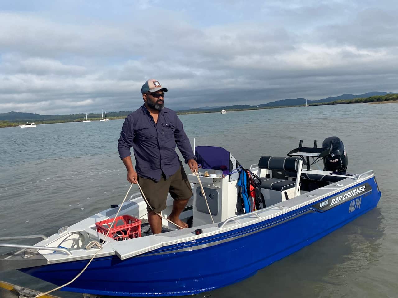 Darumbal custodian Malcolm Mann in his tinny. 