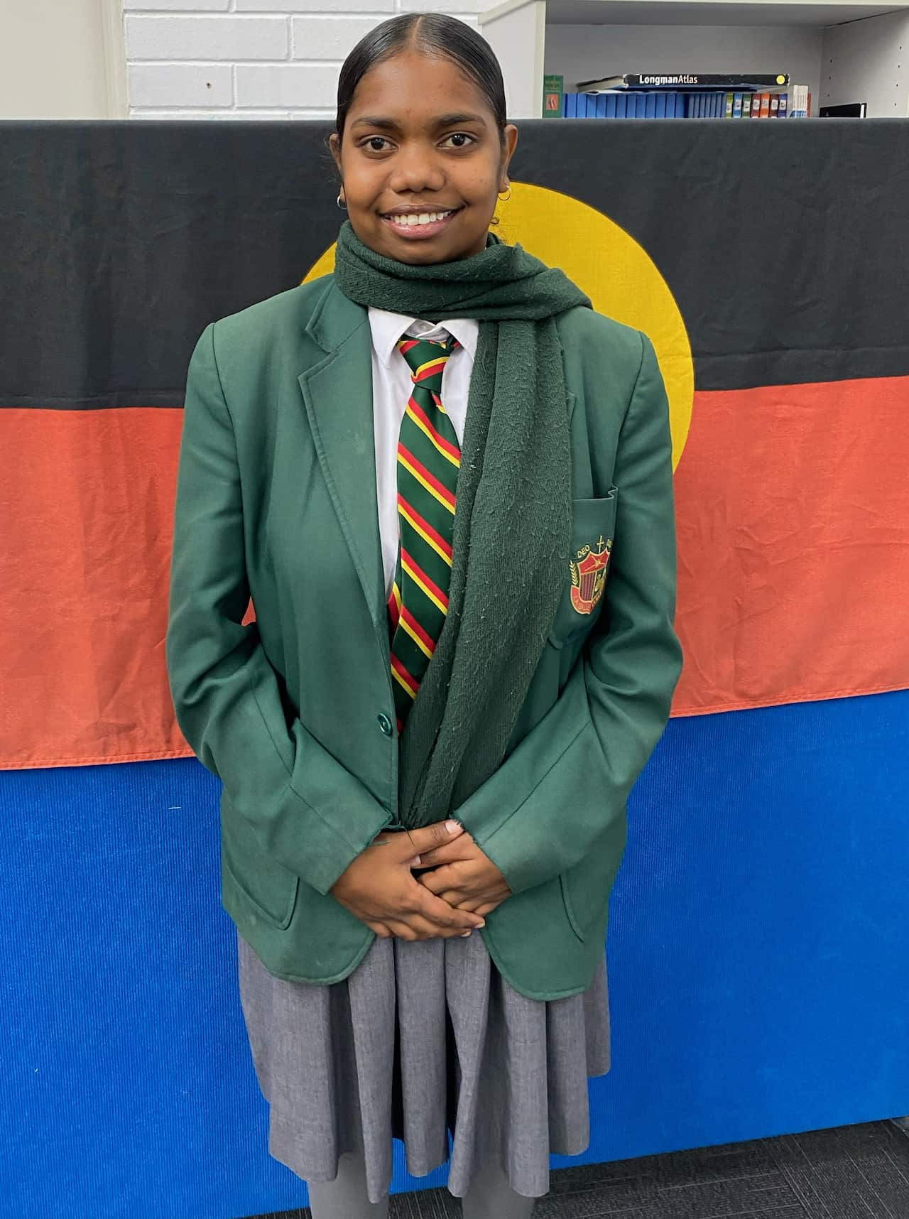 Justine standing proud in her uniform
