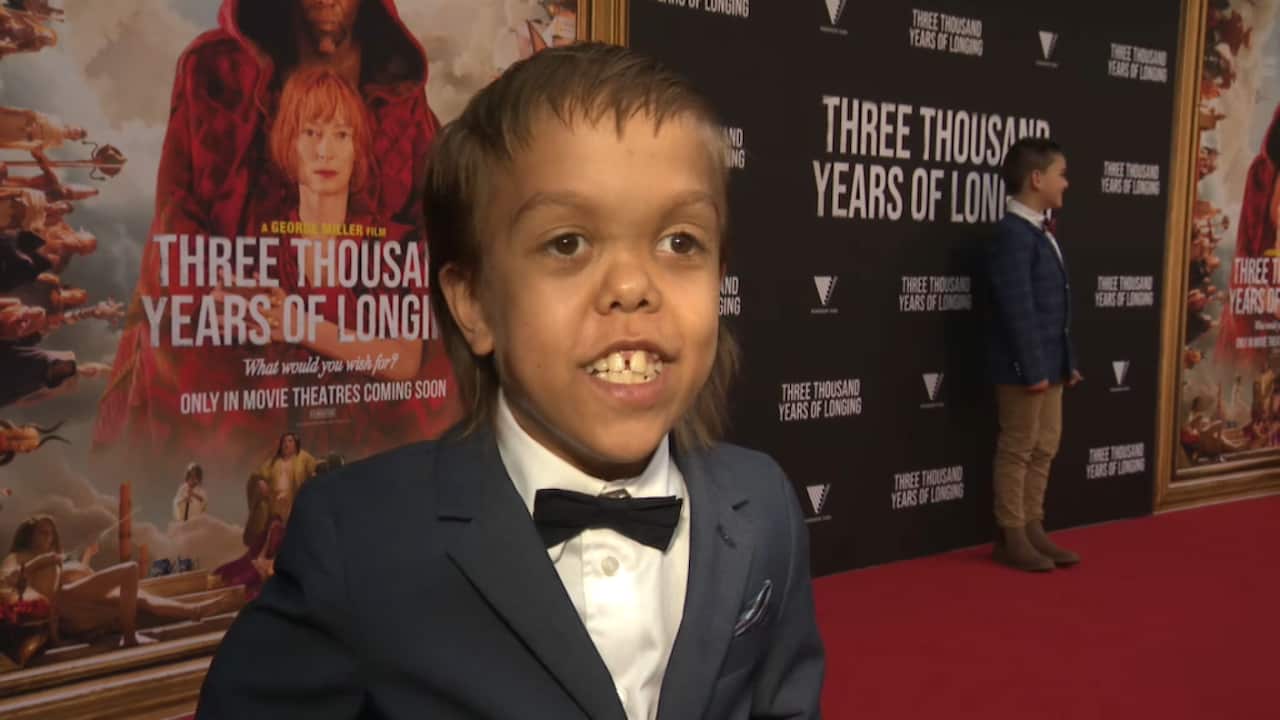 Quaden Bayles on the red carpet in a suit