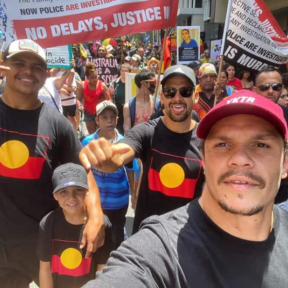 South Sydney NRL players are marching as part of the Invasion Day Rally on Gadigal land in Sydney. 