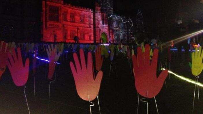 Seas of hands are seen as a symbol of reconciliation.