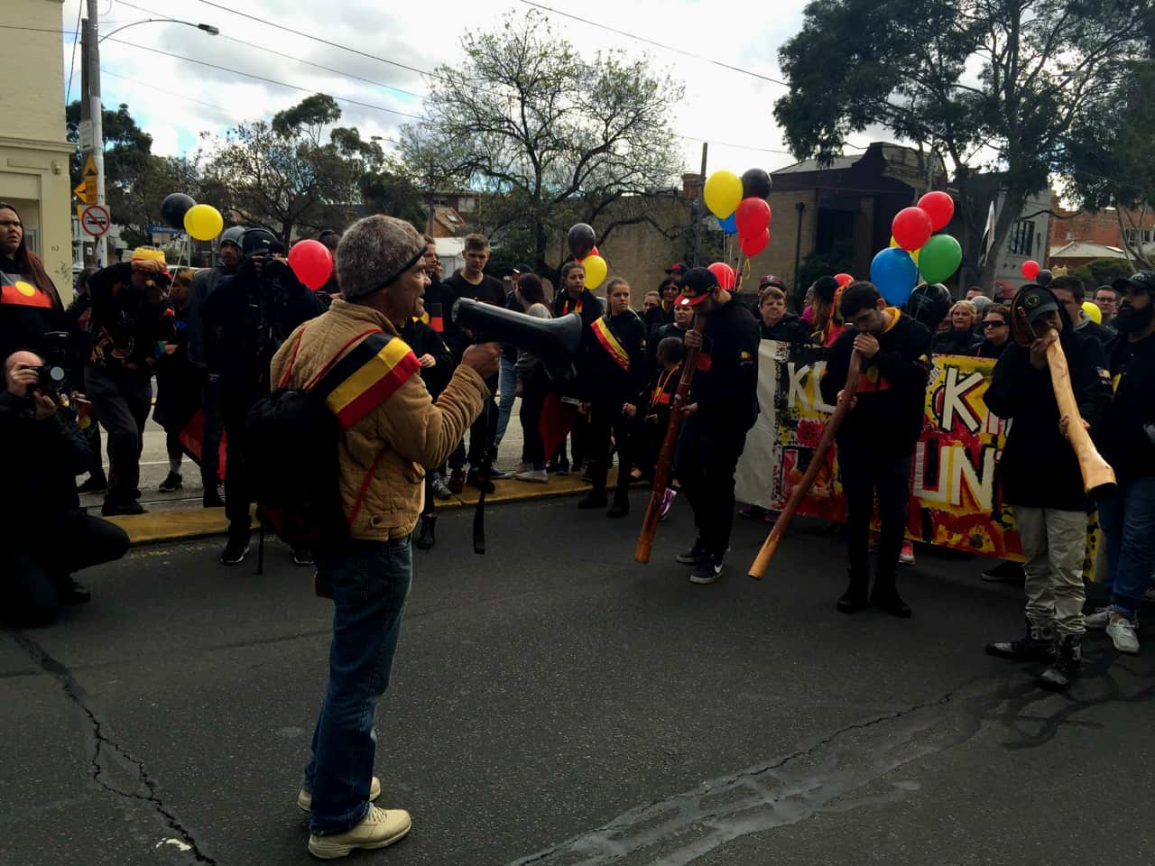 Activist Robbie Thorpe addresses a crowd at the NAIDOC march in Melbourne. 