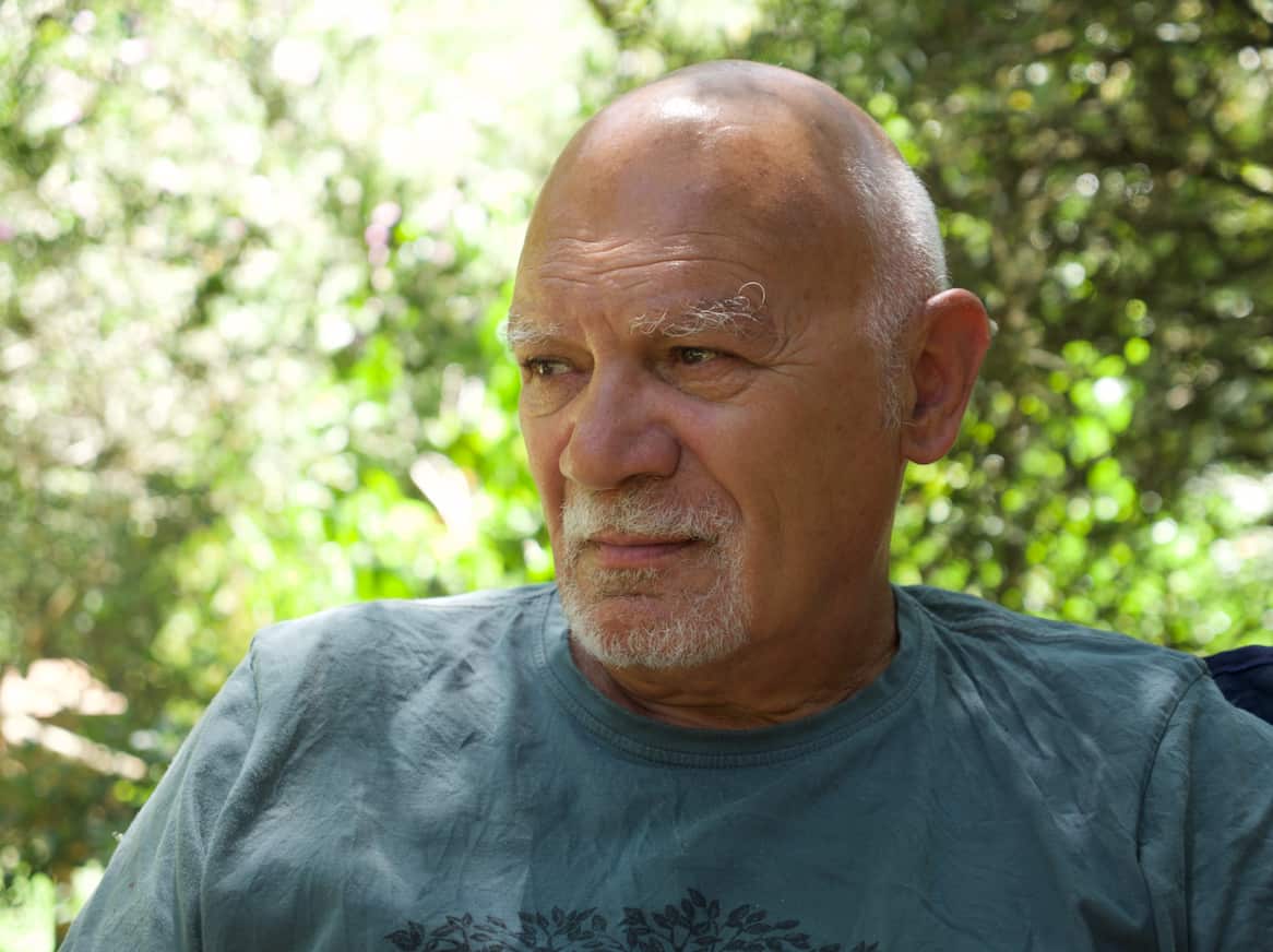 Palawa Elder Rodney Gibbins seated and contemplating the change that still needs to occur around celebrating January 26.