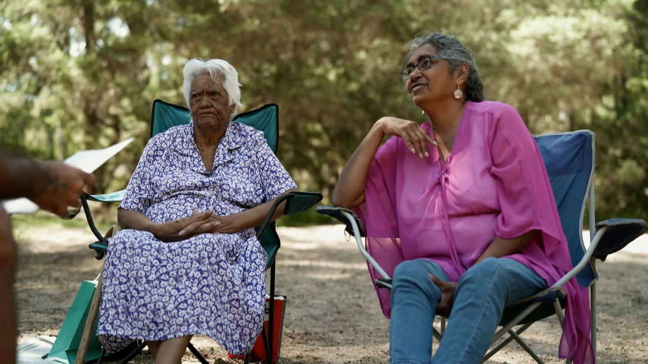 Jirrbal Elder Lillian Freeman and her daughter Margaret sitting by the banks of the Wild River. 