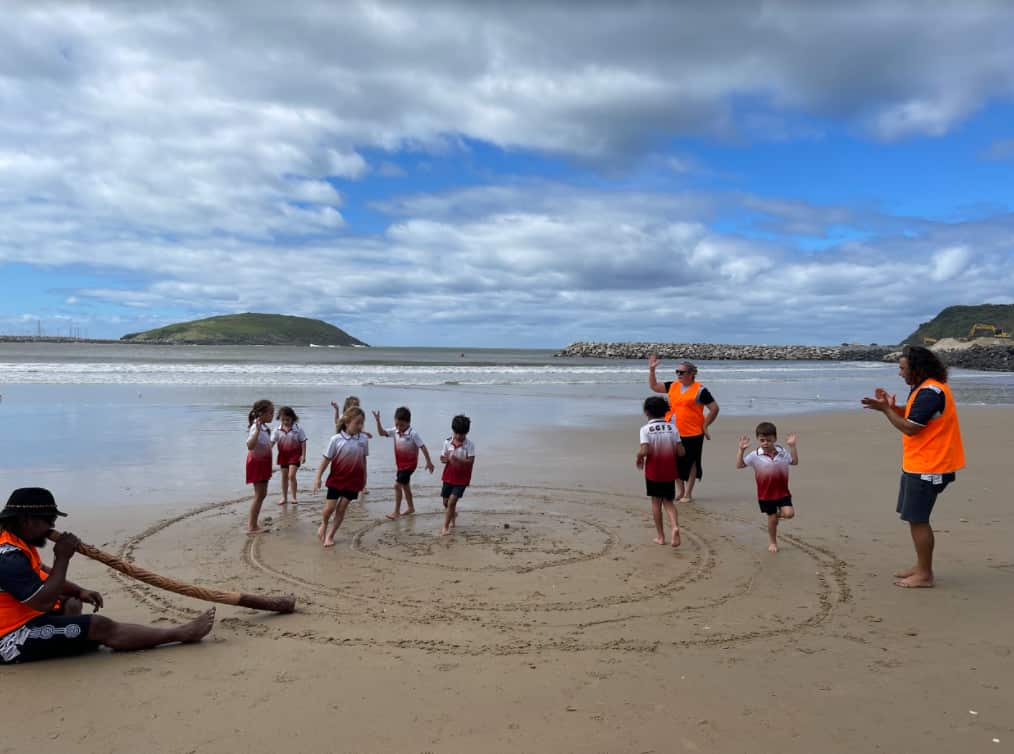 Teachers and students learn dancing on Country