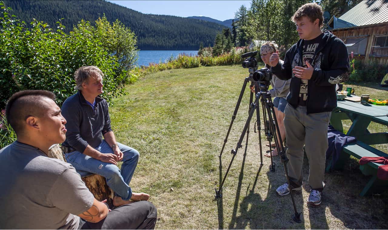 Caleb Behn (bottom left) receives directions from the crew during the filming of Fractured Land.