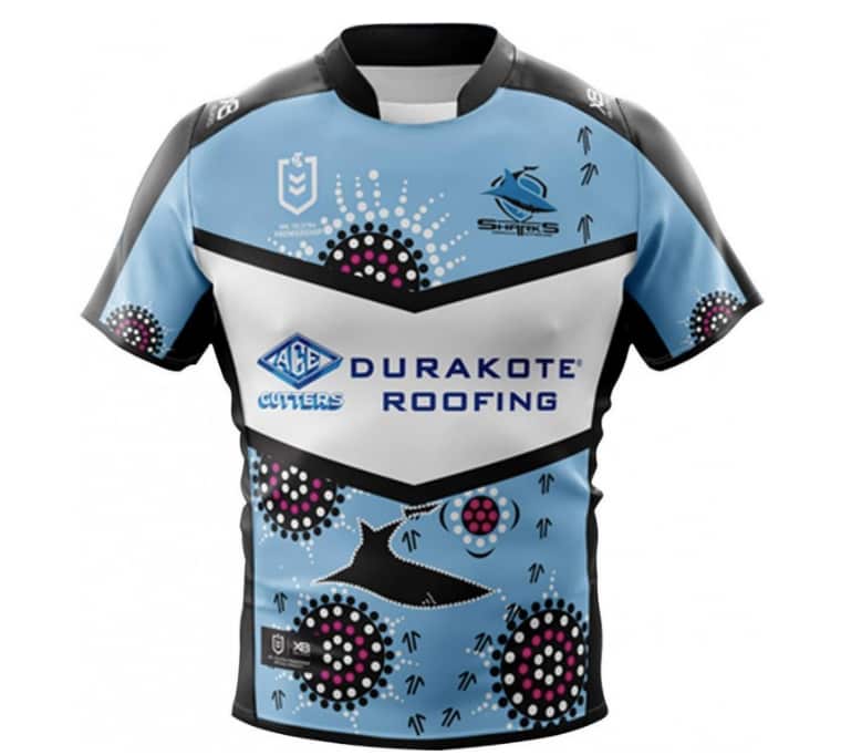 The jersey was designed by Aunty Deanna Schreiber. 'The blue on the jersey represents the waters of Cronulla, many campsites and the elders gathering.
