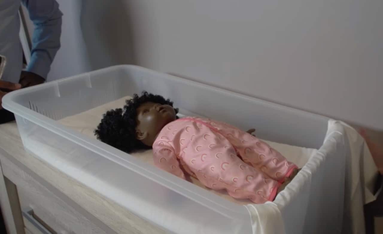 A Pepi-pod with a pretend doll inside, which is used to demonstrate to mothers on how to safely sleep their babies. 