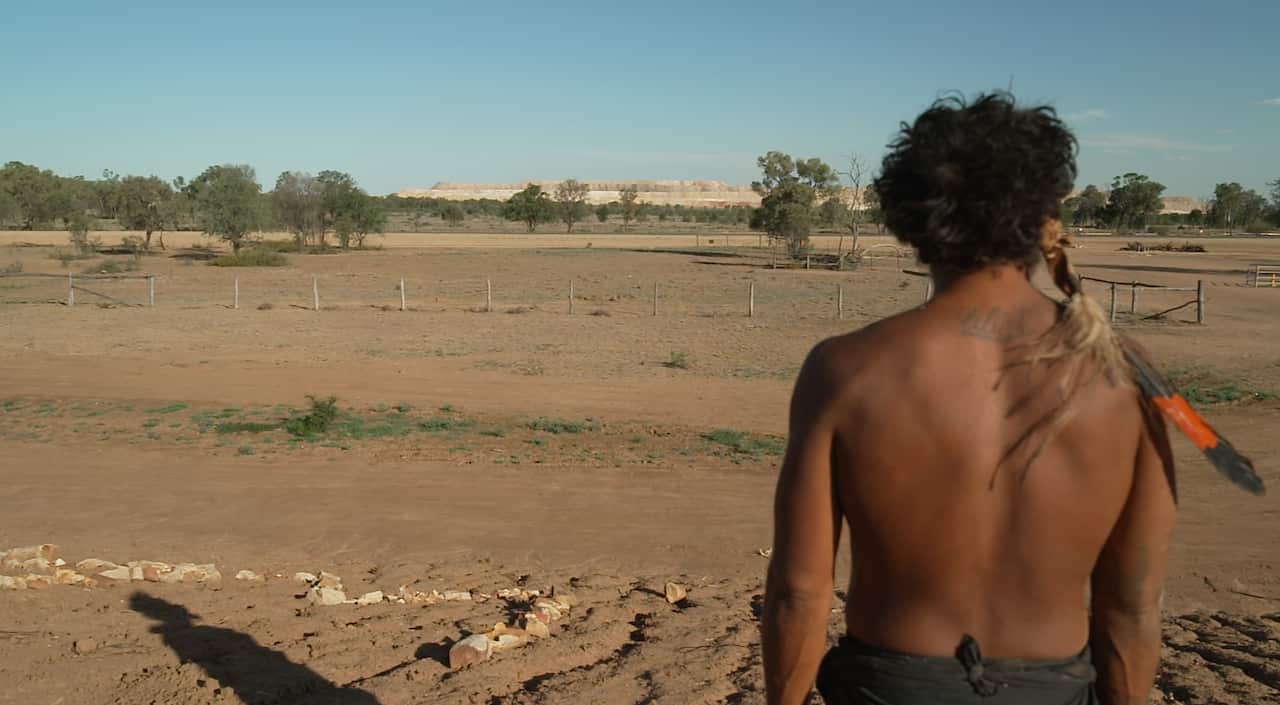 Coedie McAvoy looks out onto the mine site.