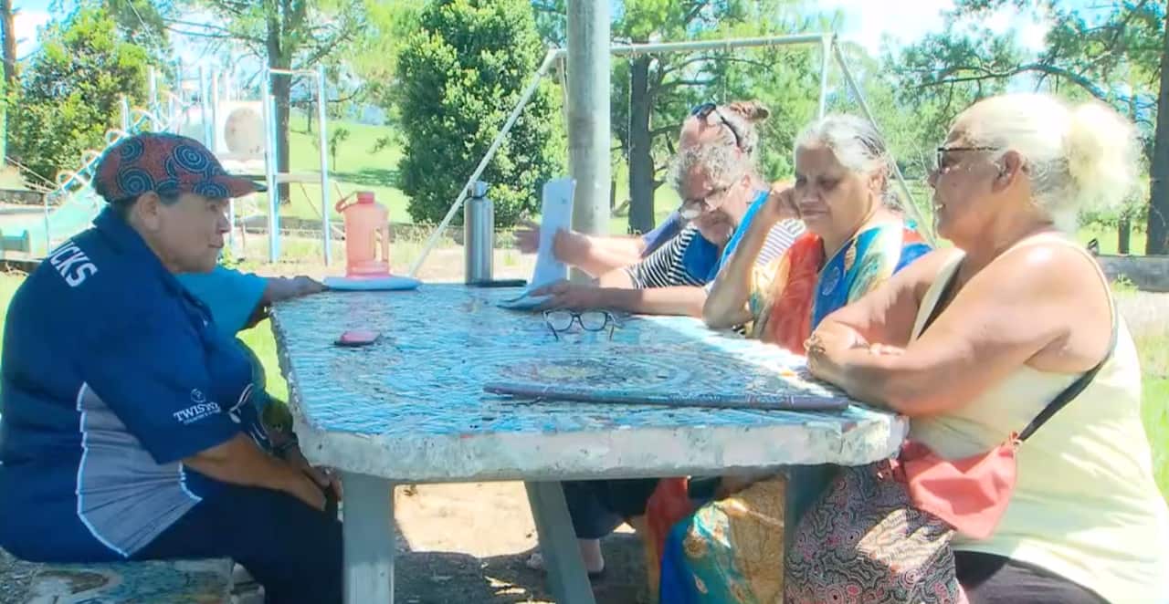 Rebecca Stadham (second from right) meets with other women in Bowraville who are customers of the ACBF.