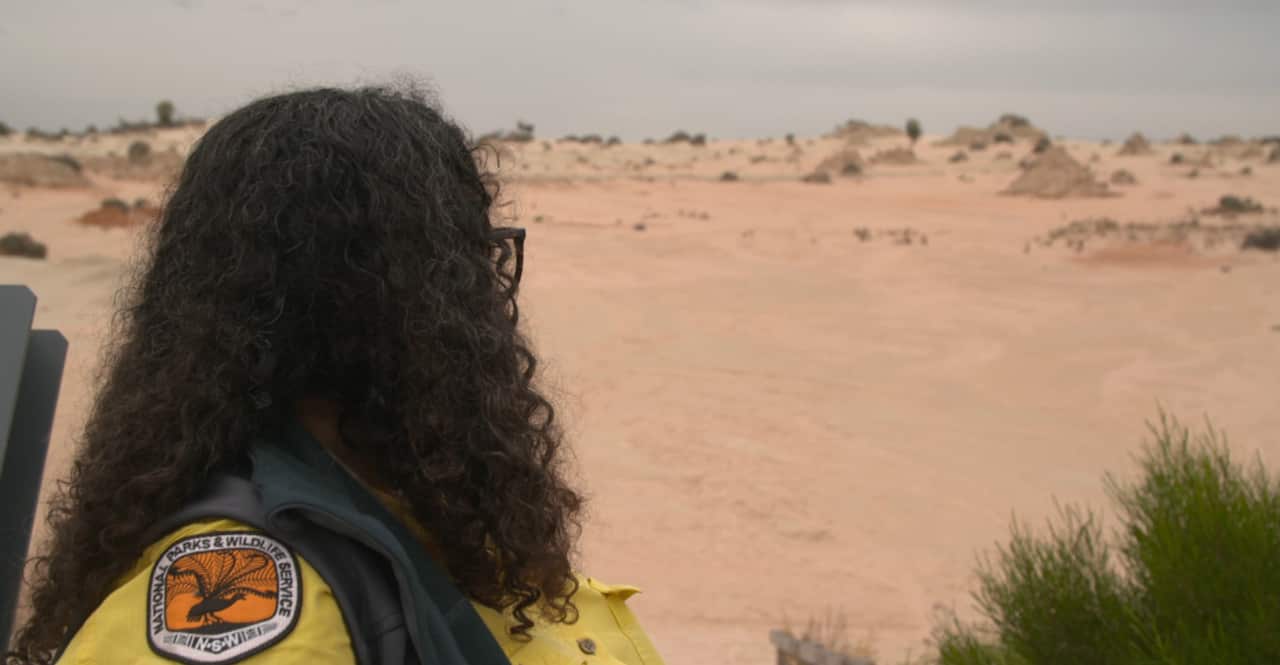 Tanya Charles looks out onto the sand dunes at Mungo National Park.