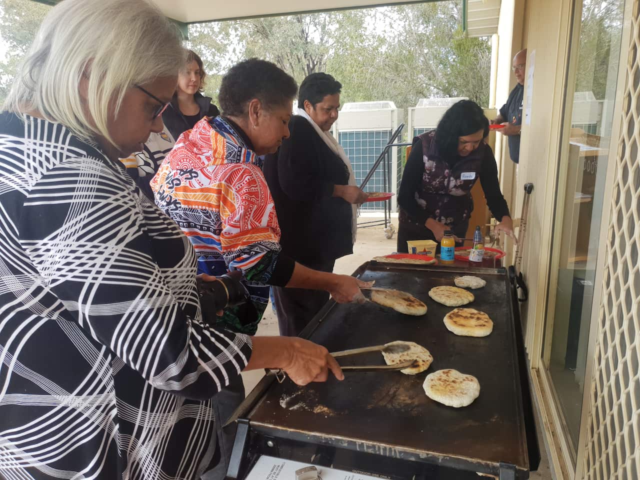Making Johnny cakes from native flours.