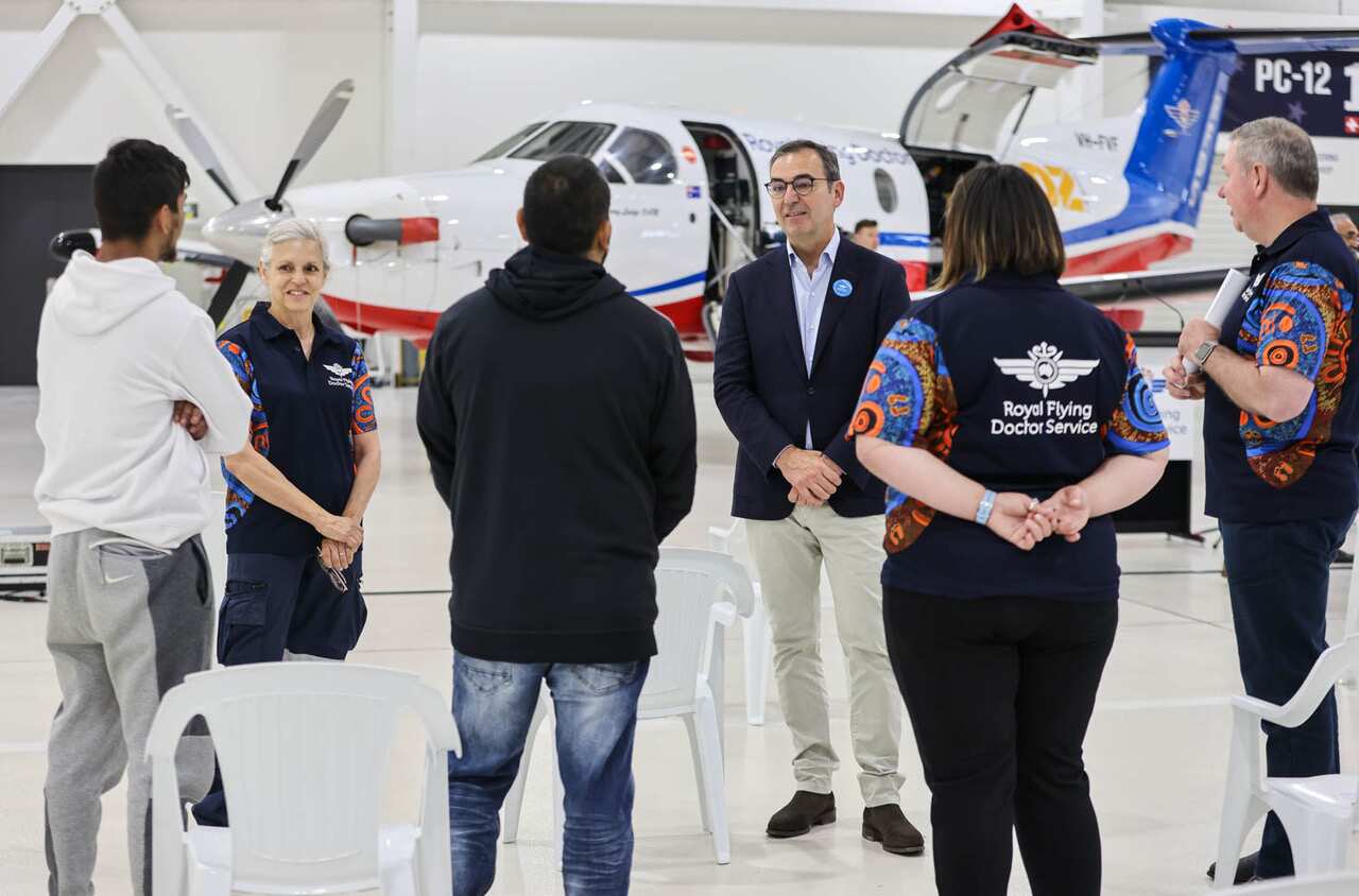 South Australian Premier Steven Marshall with RFDS staff and family members during the launch on Sunday. 