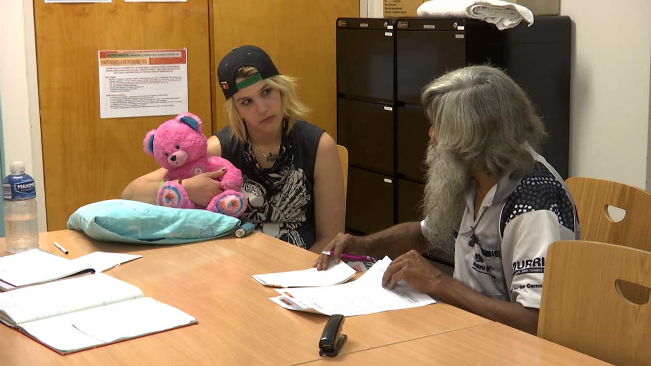 Murri Watch support worker with client