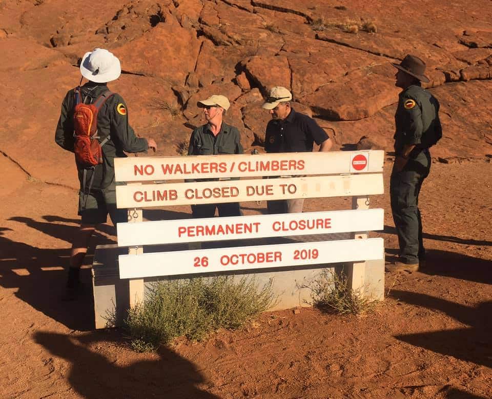 Sign at the base of Uluru announces permanent closure of the climb.