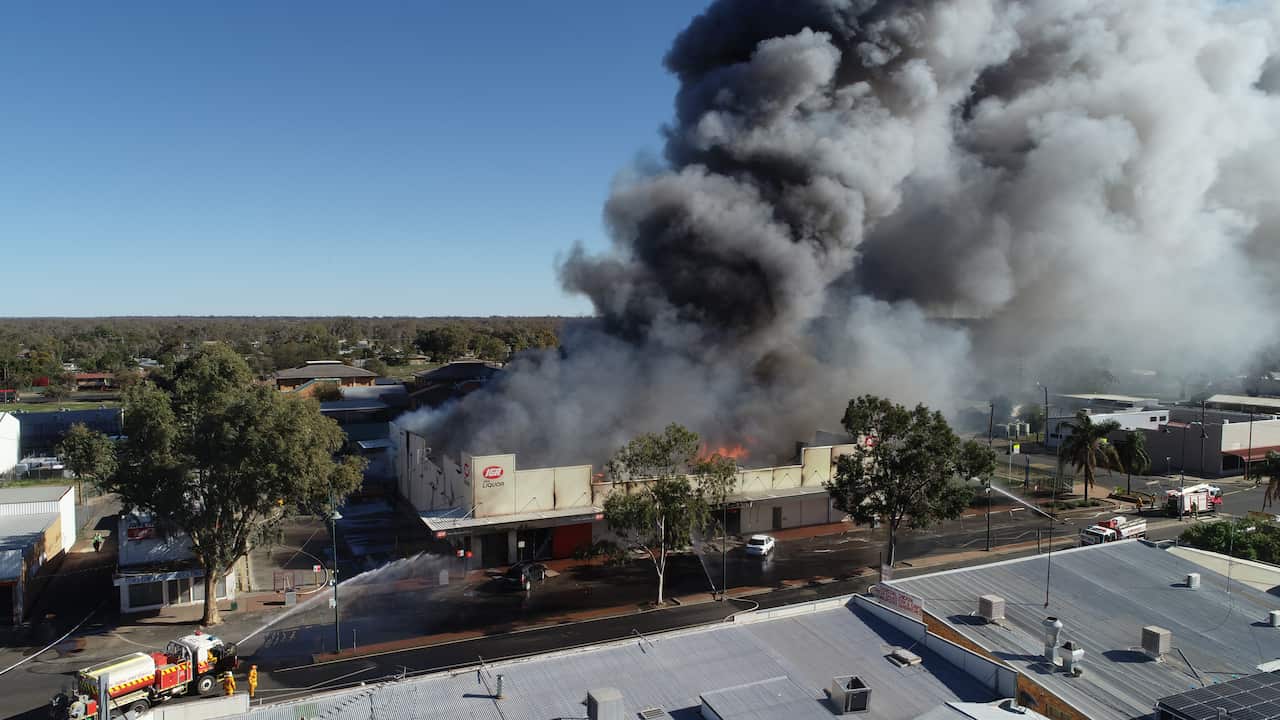 Emergency services extinguishing the blaze a blaze at Walgett's IGA superMarket. 