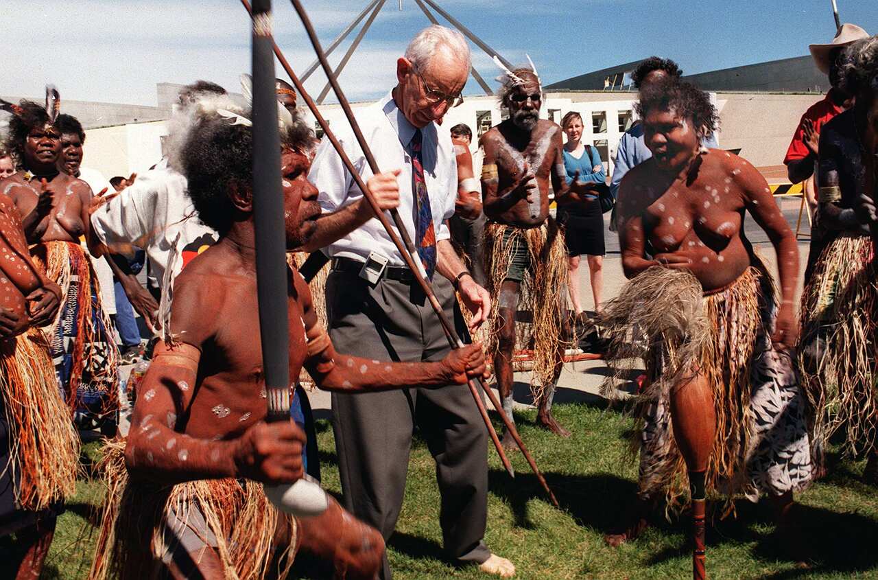 Independent /Sen Brian Harradine dances with members of Cape York Wik tribe outside Parliament House in Canberra 31/03/98. Aborigines. OldPixRef: 06325232 OldPixCat: News