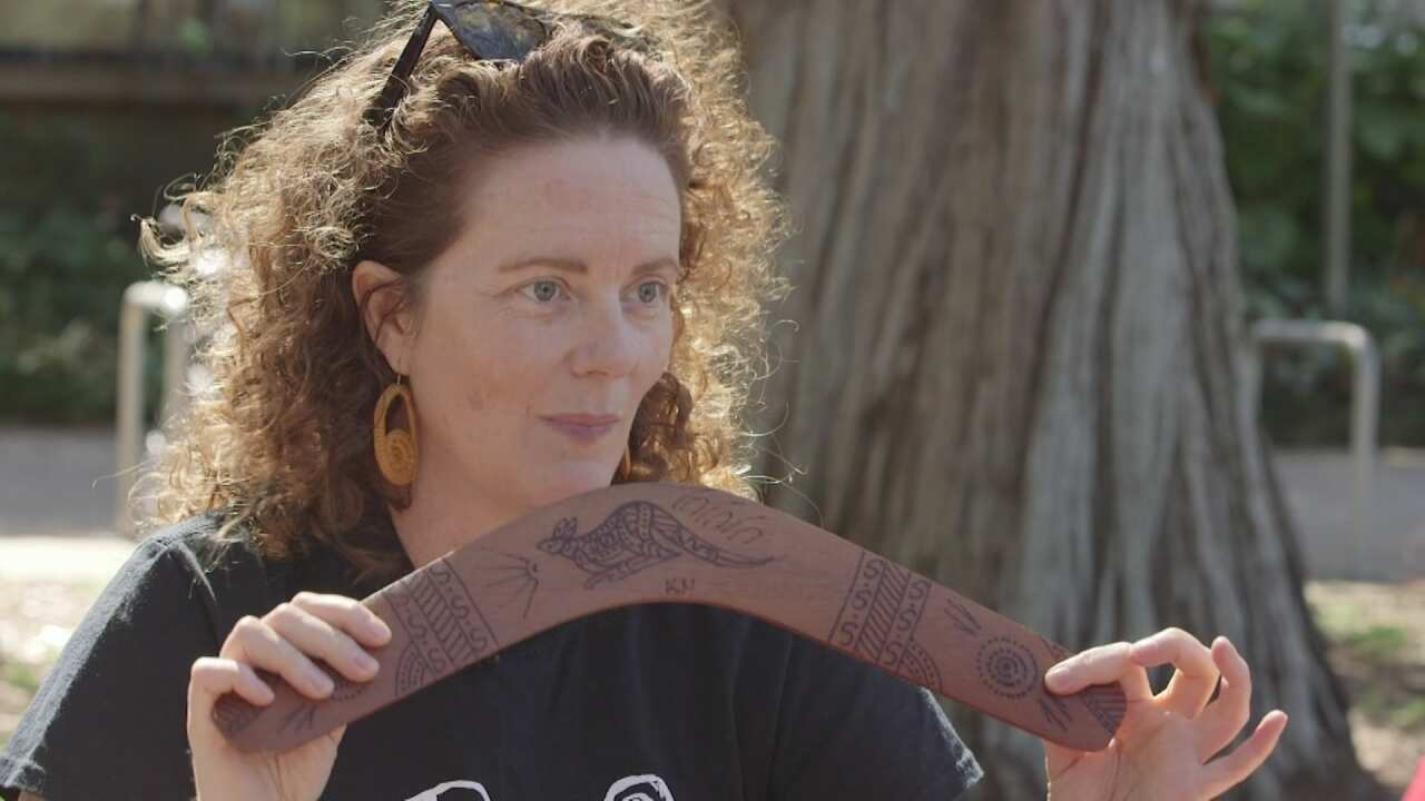 Gabrielle Sullivan holding a 'fake boomerang'