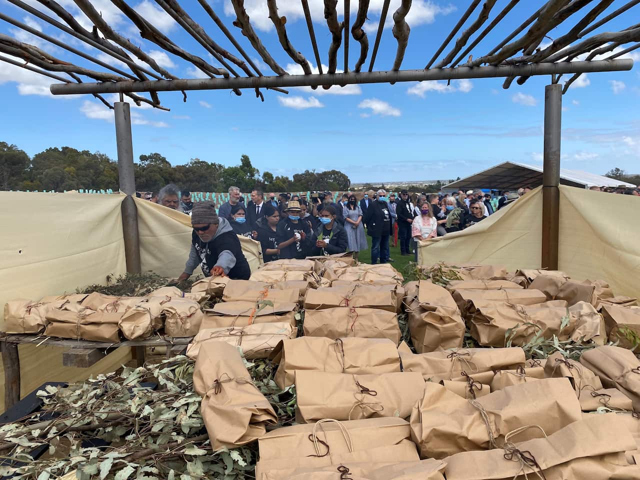 The skeletal remains individually wrapped on top of a smoking ceremony.