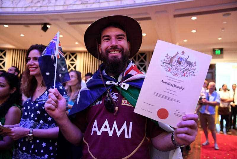  Mark Alcorn of Ireland celebrates receiving his Australian citizenship at a citizenship ceremony on Australia Day in Brisbane, Thursday, Jan. 26, 2017. 