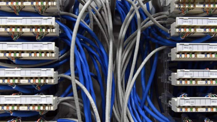 Ethernet data cables are seen in a server room in Canberra
