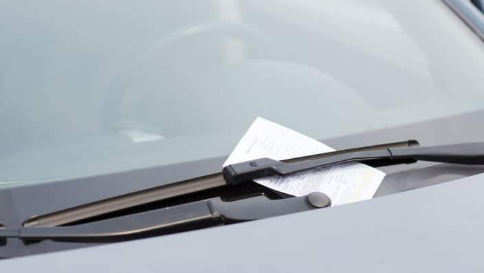 parking ticket on car windscreen