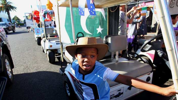 Rathamile Radebe helps prepare floats on Peel Street during the Tamworth Country Music Festival Cavalcade on January 28, 2017. 
