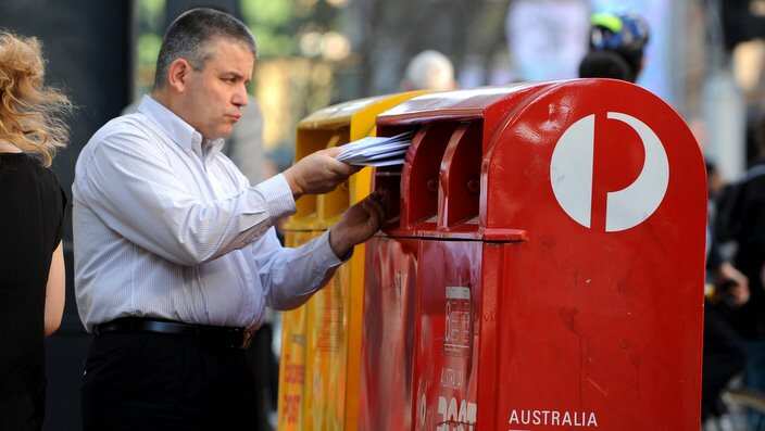 Man posting documents