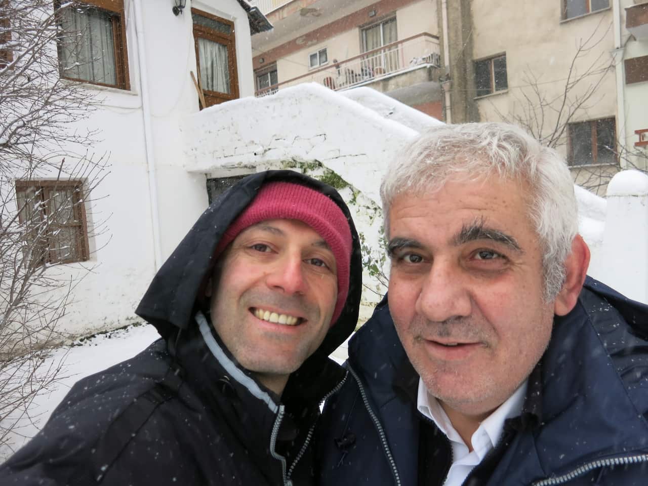 Papathanasiou (left) with his brother Billy, shovelling snow in front of their mountain home in northern Greece.