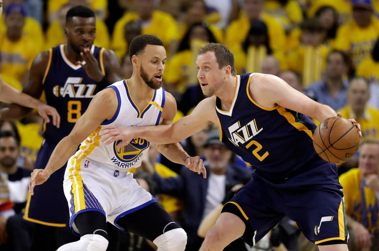 Utah Jazz's Joe Ingles (2) is defended by Golden State Warriors' Stephen Curry during the first half in Game 2 of an NBA basketball second-round playoff series, Thursday, May 4, 2017, in Oakland, Calif. (AP Photo/Marcio Jose Sanchez)